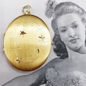 Vintage gold tone locket pendant with pink stone